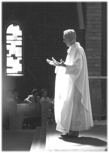 Black and white image of Bishop Remi De Roo celebrating Mass